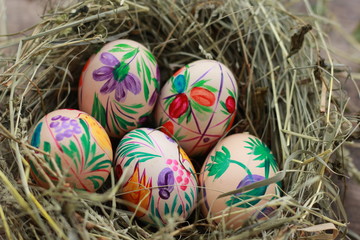 easter eggs and a nest of hay