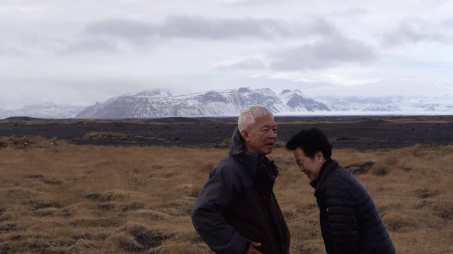 Asian senior couple anniversary trip to Iceland 4k