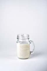 Protein cocktail with milk, vanilla in a glass jar with straws. Sports nutrition