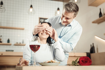 Romantic man preparing dinner to woman