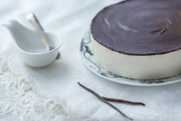 white souffle cake bird's milk with dark icing
