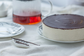 white souffle cake bird's milk with dark icing