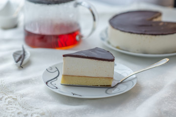 white souffle cake bird's milk with dark icing