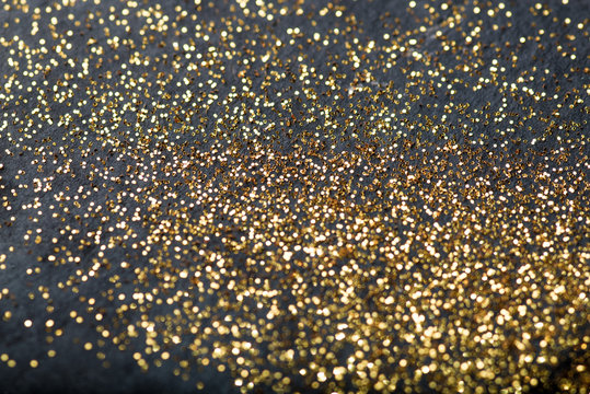 Gold Confetti On Black Background