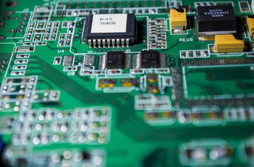 The green motherboard from the personal computer. Modern electronics and details. Correction of...