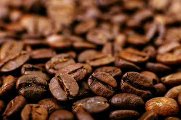 Aroma roasted coffee beans, brown background. Soft focus close up.