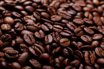 Aroma roasted coffee beans, brown background. Soft focus close up.