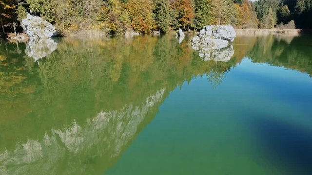 AERIAL - Lake Berglsteiner, a beautiful lake with green color in the TIroler Alps with the DJI Phantom 4.
