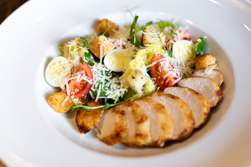 Romain salad with grilled chicken, garlic croutons and parmesan