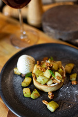 English apple crumble with nuts, mint and ice cream ball