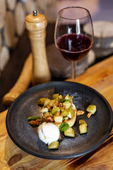 English apple crumble with nuts, mint and ice cream ball