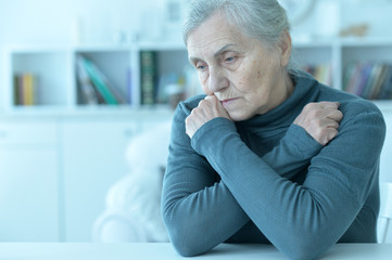 Fototapeta premium Close up portrait of tired senior woman