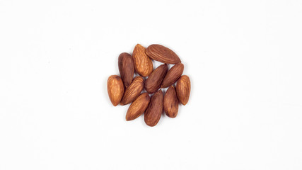 Almond on white background. Nuts lined in a circle.