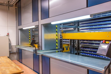 Automated storage system in the warehouse.Vertical carousel storage unit. Beautiful backgrounds. 