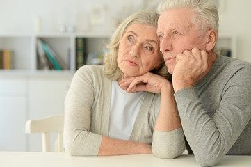 Portrait of Sad Senior couple at home