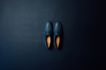 Blue, men's shoes on a black background. Footwear. Fashion. Style. - Powered by Adobe
