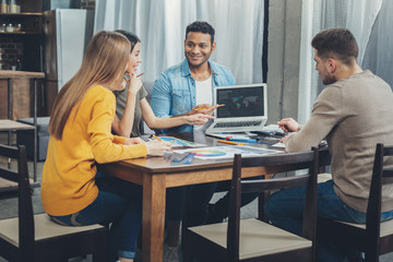 Positive four colleagues launching startup