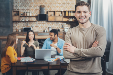 Positive male colleague aiming at resul