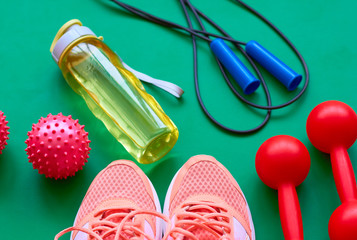 Sneakers, jump rope and water bottle. Morning fitness.