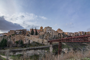 Cuenca , Spain; February 2017:  This view shows the Hanging Houses perched on the cliffside and Bridge of San Pablo, over the Huecar River 