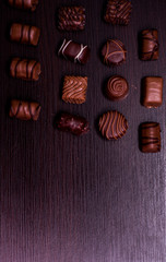 coffee and chocolate candies on a black background