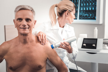 Young doctor using modern medical facilities for examination