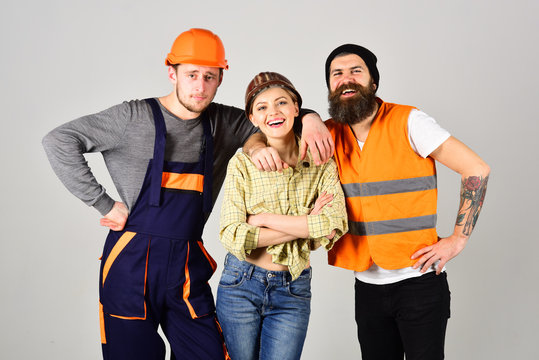 The best team ever. Men and woman builders in workwear. Construction technicians. Construction workers team. Constructing engineers or architects. Professional working team or teamwork