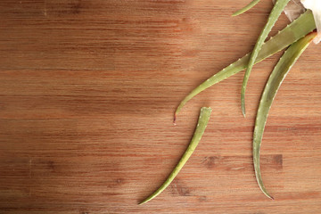 Cutted pieces of aloe vera on the wooden table 