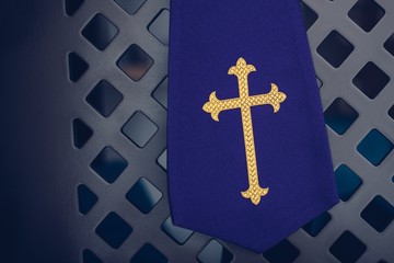 Purple fabric stole in confessional in church.