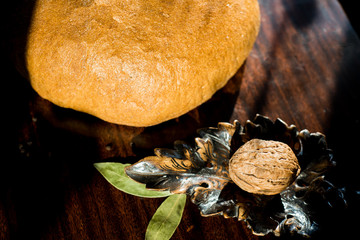 Homemade whole grain bread on a dark background.