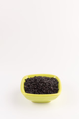 bowl of black wild rice isolated on white background