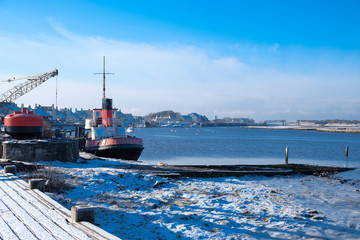 Harbour Street Irvine and the Old Puffer with winter Ice on the Frozen shore in Scotland's North Ayrshire