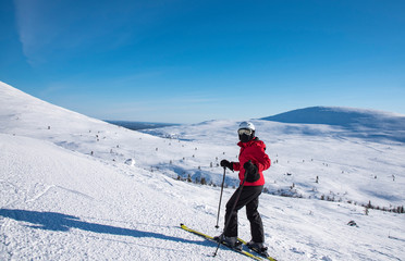 Fototapeta na wymiar Woman downhill skiing in Lapland Finland