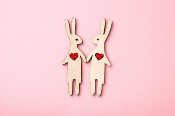 happy couple of wooden rabbits in love