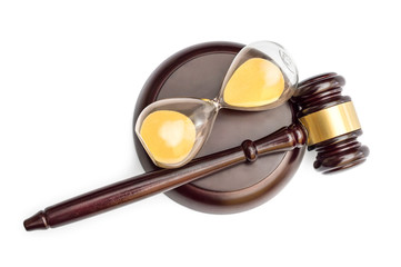 Judge's gavel with hourglass on white. Top view.