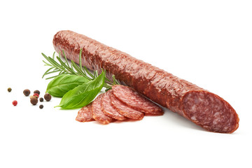 Fresh and dried sausage with herbs, close-up, isolated on white background