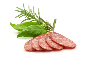 Dried salami slices with herbs, close-up, isolated on white background