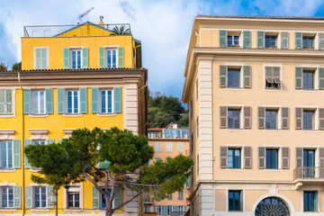 Obraz premium Nice in France, colorful facade, with typical windows and green shutters