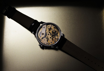 Beautiful handmade wristwatches on a golden background.