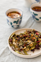 Spring detox concept.  Herbal tea in a ceramic tableware and tea cups