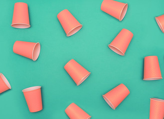 Plastic cups on blue background. Plastic free concept.