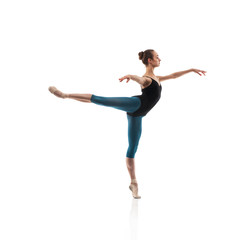 Fototapeta premium Ballerina in black outfit posing on toes.