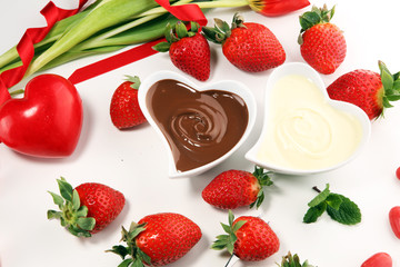 Valentine Chocolate fondue melted with fresh strawberries and dark and white chocolate. Tublips and sugar hearts.