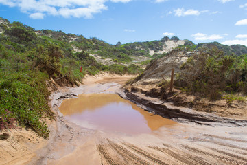 A large puddle on offroad track in national park in South Australia
