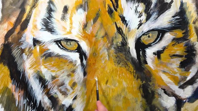 Artistic hand-painting of a tiger's eye,  time lapse, rotate