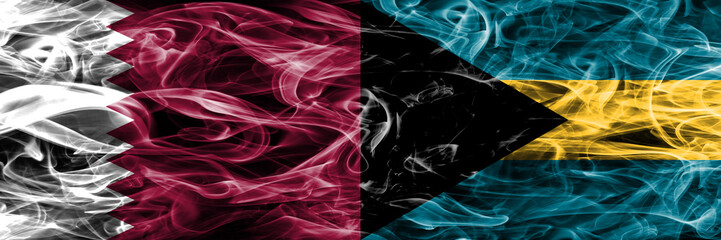 Obraz premium Qatar vs Bahamas, Bahamian smoke flags placed side by side. United Arab Emirates. UAE.