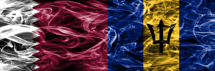 Obraz premium Qatar vs Barbados, Barbadian smoke flags placed side by side. United Arab Emirates. UAE.