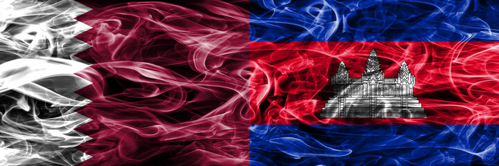 Obraz premium Qatar vs Cambodia, Cambodian smoke flags placed side by side. United Arab Emirates. UAE.