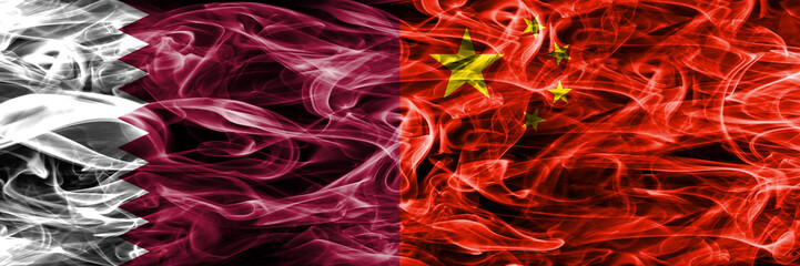 Qatar vs China, Chinese smoke flags placed side by side. United Arab Emirates. UAE.