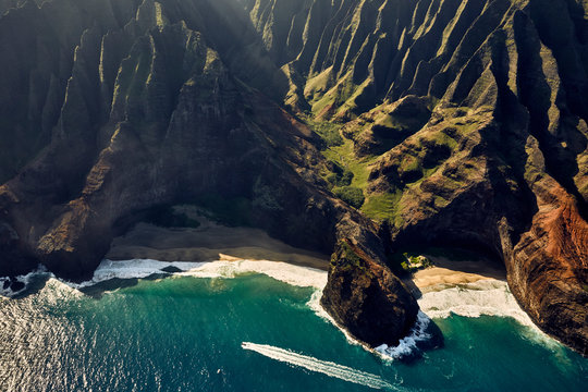 Aerial view of speedboat moving in cove, Hawaii © Christopher
